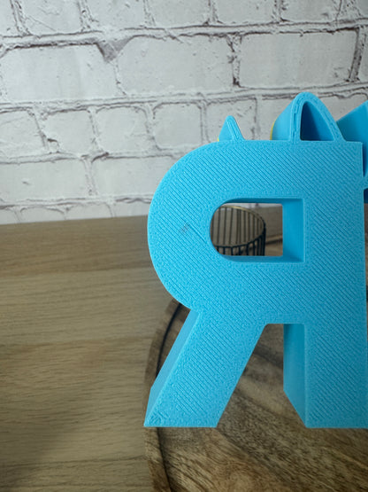 B-Ware 3D-Schriftzug „schön hier“ – hellblau & gelb (17 cm)
