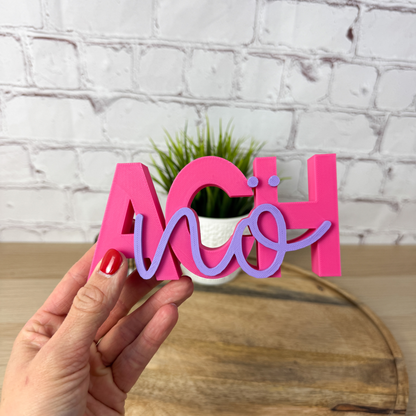 Pinker 3D Schriftzug „Ach nö“ mit lila Schrift als lustiger Deko Schriftzug